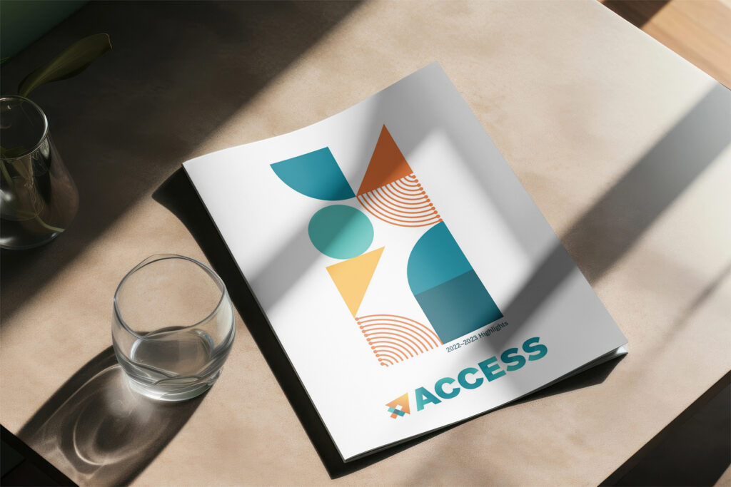 An image of the ACCESS booklet on a sun-drenched desk.