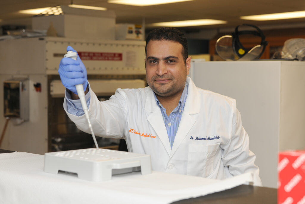 Dr. Mohamed Abouelkhair in his lab performing tests.